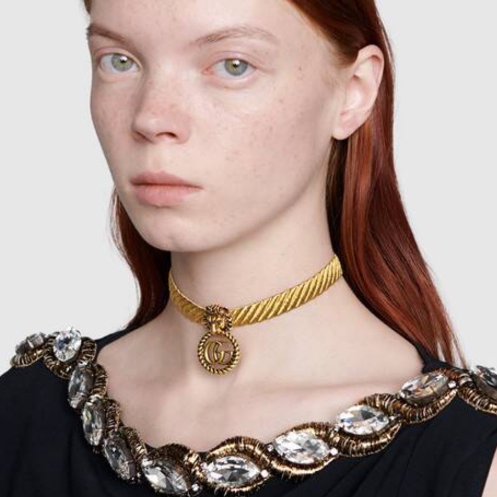 I am selling a lion head choker with double g.